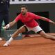 Serbia's Novak Djokovic plays a shot against Germany's Alexander Zverev during their quarterfinal match of the French Tennis Open at the Roland-Garros stadium in Paris, Wednesday, June 4, 2025. (AP Photo/Aurelien Morissard)