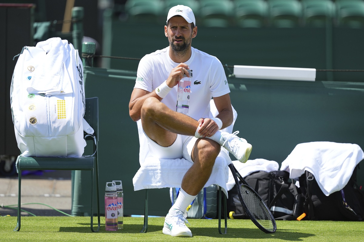 Novak Djokovic of Serbia sits in his chair during a practice session at the All England Lawn Tennis and Croquet Club, ahead of the Wimbledon Championships in London, Wednesday, June 25, 2025. (AP Photo/Kirsty Wigglesworth)