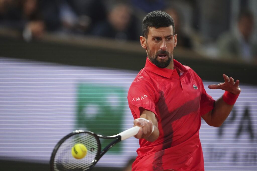 Serbia's Novak Djokovic plays a shot against Germany's Alexander Zverev during their quarterfinal match of the French Tennis Open at the Roland-Garros stadium in Paris, Wednesday, June 4, 2025. (AP Photo/Lindsey Wasson)