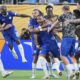 Chelsea's Christopher Nkunku is congratulated after scoring his teams second goal during the Club World Cup round of 16 soccer match between Benfica and Chelsea in Charlotte, N.C., Saturday, June 28, 2025. (AP Photo/Chris Carlson)