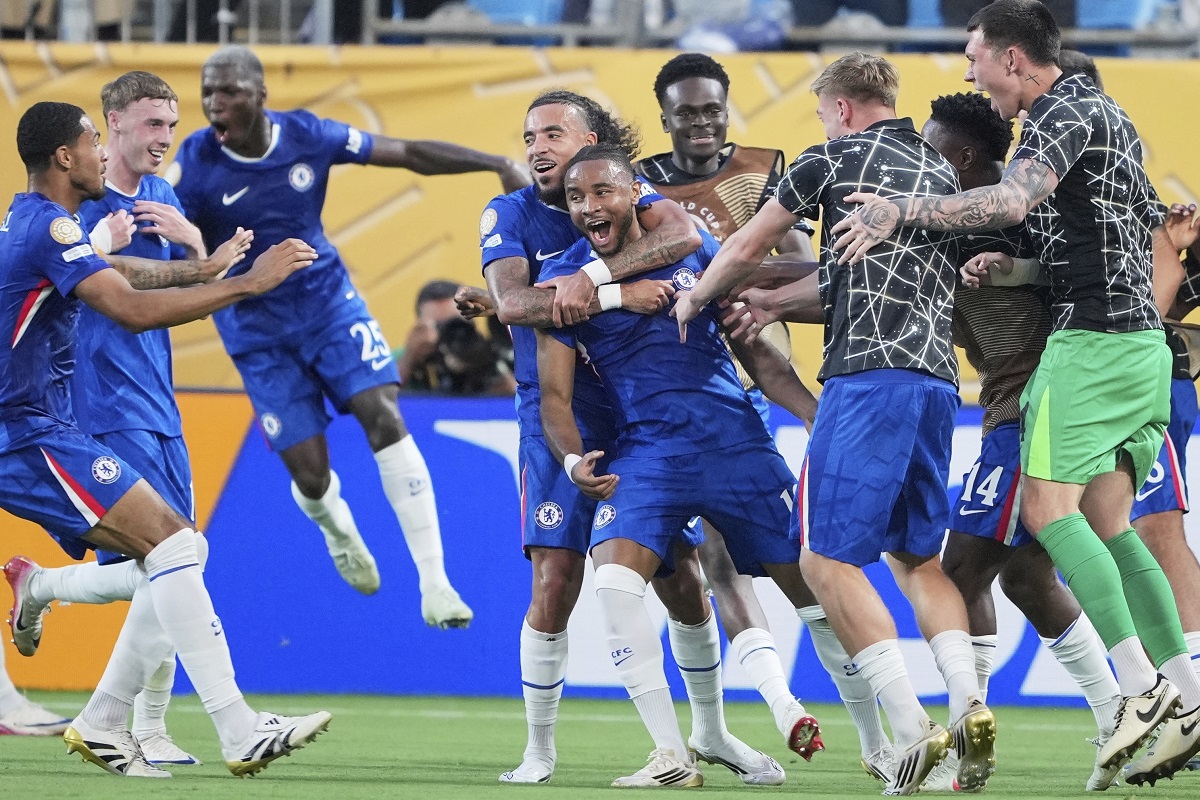 Chelsea's Christopher Nkunku is congratulated after scoring his teams second goal during the Club World Cup round of 16 soccer match between Benfica and Chelsea in Charlotte, N.C., Saturday, June 28, 2025. (AP Photo/Chris Carlson)