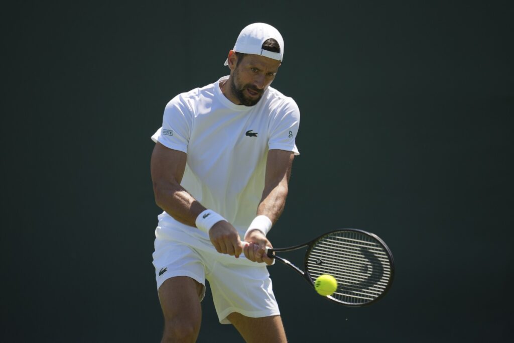 Novak Djokovic of Serbia attends a practice session ahead of the Wimbledon Championships in London, Friday, June 27, 2025. (AP Photo/Kin Cheung)
