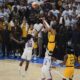 Indiana Pacers guard Tyrese Haliburton (0) shoots a 3-pointer against Oklahoma City Thunder guard Cason Wallace (22) during the second half of Game 1 of the NBA Finals basketball series Thursday, June 5, 2025, in Oklahoma City. (AP Photo/Nate Billings)