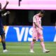 Paris Saint-Germain's Willian Pacho, left, signals as Inter Miami's Lionel Messi, center, walks away during the Club World Cup round of 16 soccer match between PSG and Inter Miami in Atlanta, Sunday, June 29, 2025. (AP Photo/Brynn Anderson)