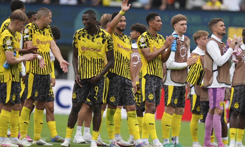 Players of Borussia Dortmund stand on the pitch at the end of the Club World Cup group F soccer match between Fluminense and Borussia Dortmund in East Rutherford, N.J., Tuesday, June 17, 2025. (AP Photo/Frank Franklin II)
