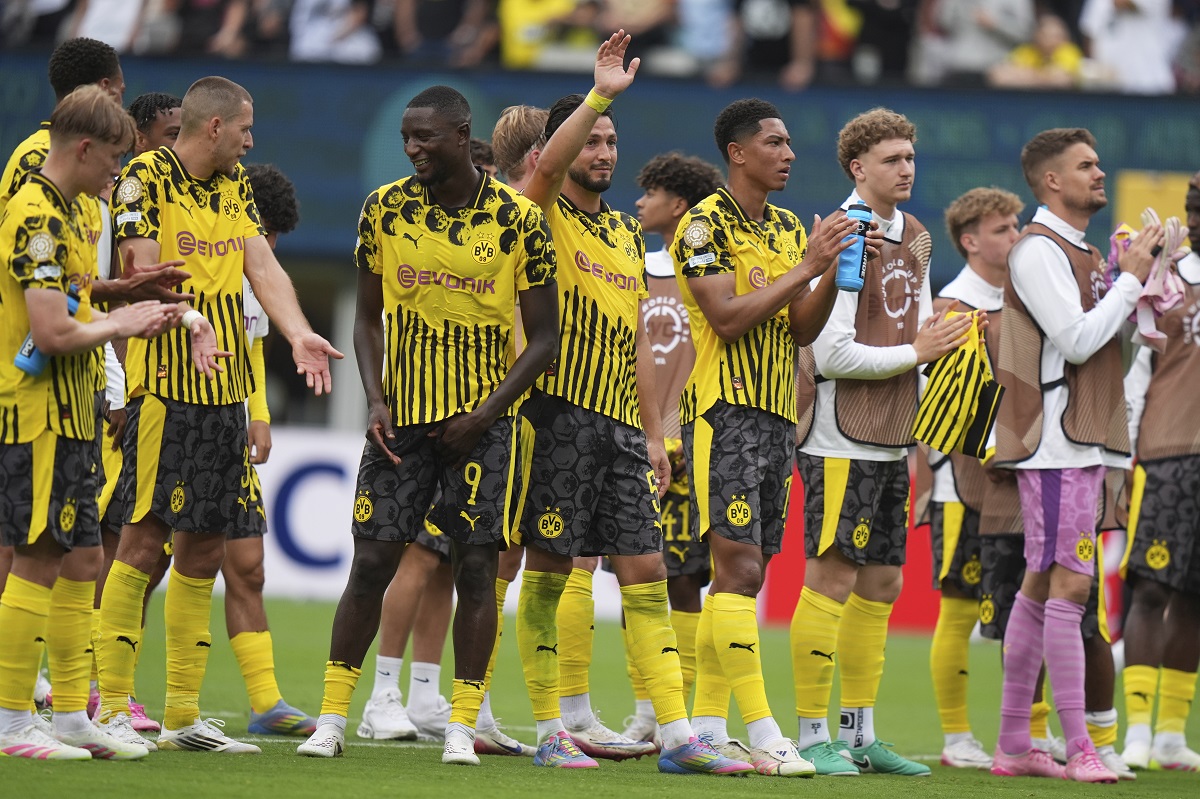 Players of Borussia Dortmund stand on the pitch at the end of the Club World Cup group F soccer match between Fluminense and Borussia Dortmund in East Rutherford, N.J., Tuesday, June 17, 2025. (AP Photo/Frank Franklin II)