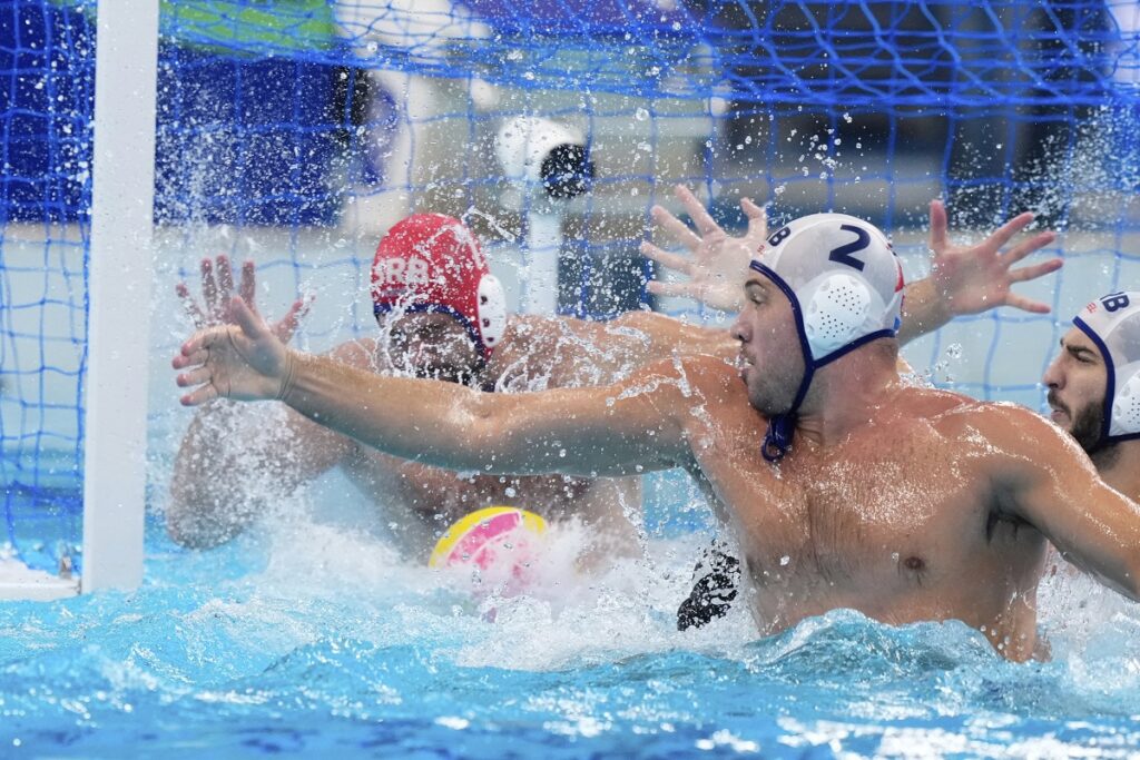 Serbia's goalkeeper Radoslav Filipovic makes a save during a men's water polo semifinal match between Serbia and Hungary at the World Aquatics Championships in Singapore, Tuesday, July 22, 2025. (AP Photo/Vincent Thian)