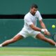 Novak Djokovic of Serbia returns to Miomir Kecmanovic of Serbia during a third round men's singles match at the Wimbledon Tennis Championships in London, Saturday, July 5, 2025. (AP Photo/Kirsty Wigglesworth)