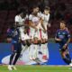 AC Milan's players in white blocks the ball during a friendly match against Arsenal for the Singapore Festival of Football at the National Stadium in Singapore, Wednesday, July 23, 2025. (AP Photo/Vincent Thian)