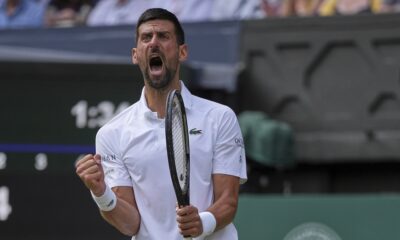 Serbia's Novak Djokovic celebrates after winning the second set against Australia's Alex de Minaur during a fourth round men's singles match at the Wimbledon Tennis Championships in London, Monday, July 7, 2025. (AP Photo/Kin Cheung)