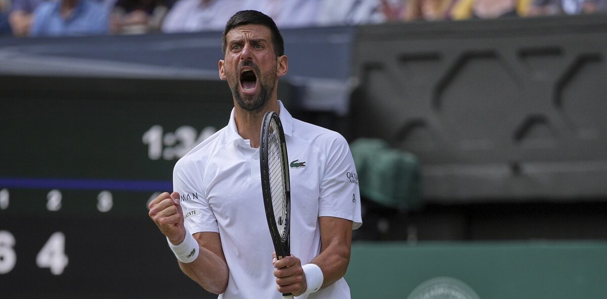 Serbia's Novak Djokovic celebrates after winning the second set against Australia's Alex de Minaur during a fourth round men's singles match at the Wimbledon Tennis Championships in London, Monday, July 7, 2025. (AP Photo/Kin Cheung)