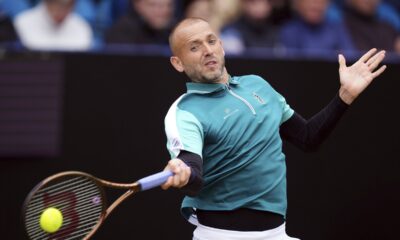 Daniel Evans returns the ball during his match against Jenson Brooksby on day four of the Eastbourne Open at Devonshire Park Lawn Tennis Club, Eastbourne, England, Thursday June 26, 2025. (John Walton/PA via AP)