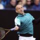 Daniel Evans returns the ball during his match against Jenson Brooksby on day four of the Eastbourne Open at Devonshire Park Lawn Tennis Club, Eastbourne, England, Thursday June 26, 2025. (John Walton/PA via AP)