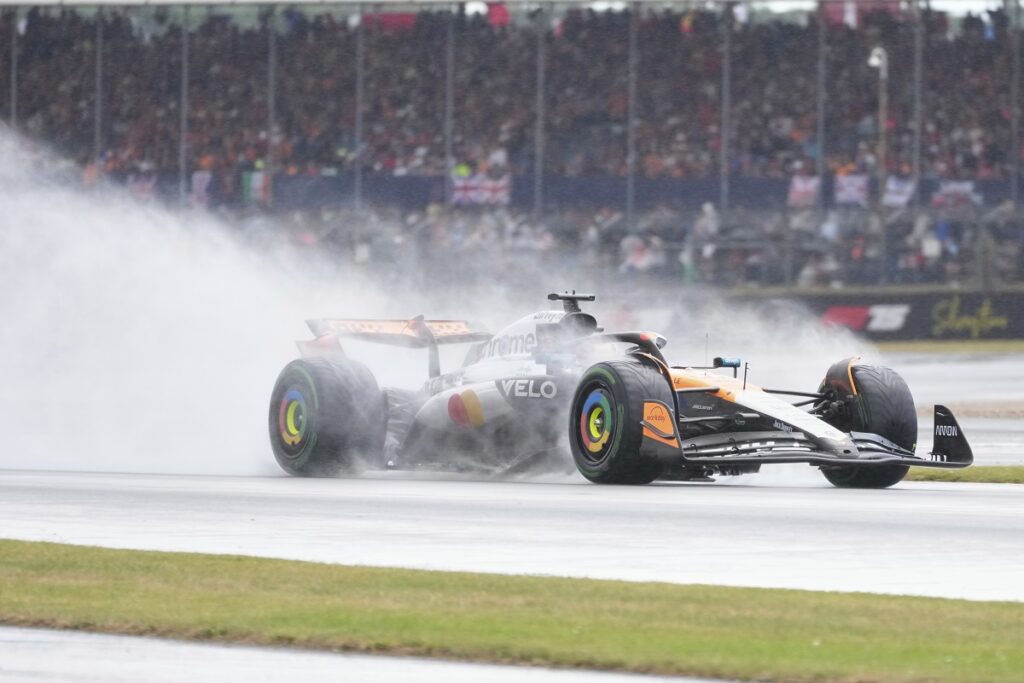McLaren driver Oscar Piastri of Australia steers his car as it rains during the British Formula One Grand Prix race at the Silverstone racetrack in Silverstone, England, Sunday, July 6, 2025. (AP Photo/Darko Bandic)
