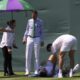 Hamad Medjedovic of Serbia lies injured on the court after he ran into a board during his first round men's singles match against Sebastian Ofner of Austria at the Wimbledon Tennis Championships in London, Tuesday, July 1, 2025.(AP Photo/Dave Shopland)