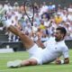 Novak Djokovic of Serbia sits on the grass after diving to return to Miomir Kecmanovic of Serbia during a third round men's singles match at the Wimbledon Tennis Championships in London, Saturday, July 5, 2025. (AP Photo/Kirsty Wigglesworth)