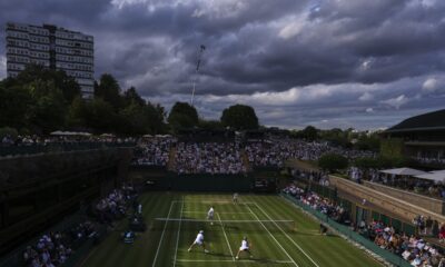 Dark clouds hover over the tennis courts at the Wimbledon Tennis Championships in London, Sunday, July 6, 2025.(AP Photo/Kirsty Wigglesworth)