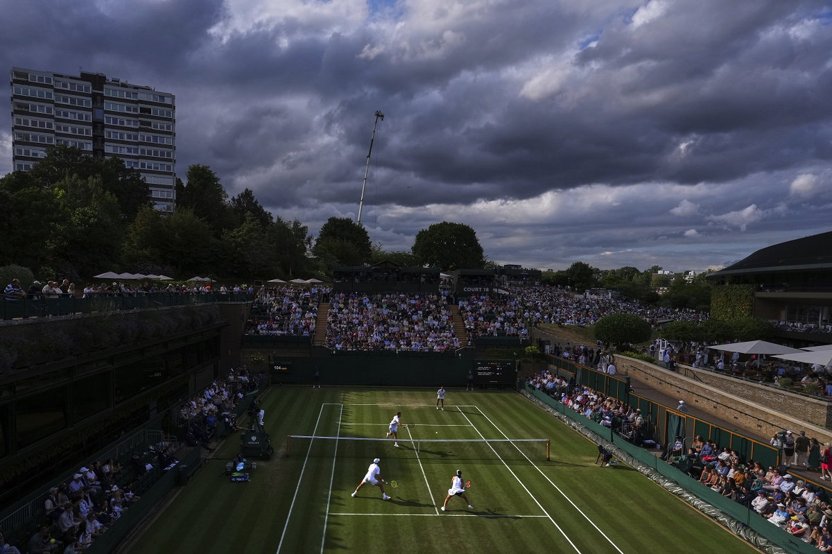Dark clouds hover over the tennis courts at the Wimbledon Tennis Championships in London, Sunday, July 6, 2025.(AP Photo/Kirsty Wigglesworth)