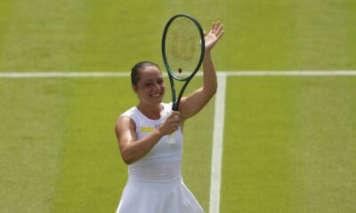 Elisabetta Cocciaretto of Italy celebrate winning her women's first round singles match against Jessica Pegula of the U.S. at the Wimbledon Tennis Championships in London, Tuesday, July 1, 2025.(AP Photo/Joanna Chan)