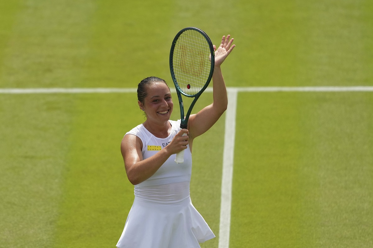 Elisabetta Cocciaretto of Italy celebrate winning her women's first round singles match against Jessica Pegula of the U.S. at the Wimbledon Tennis Championships in London, Tuesday, July 1, 2025.(AP Photo/Joanna Chan)