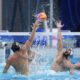 Hungary's Zsombor Vismeg, left, attempts to score against Serbia's Milos Cuk during a men's water polo semifinal match between Serbia and Hungary at the World Aquatics Championships in Singapore, Tuesday, July 22, 2025. (AP Photo/Vincent Thian)