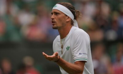 Alexander Zverev of Germany reacts as he plays Arthur Rinderknech of France during their first round men's singles match at the Wimbledon Tennis Championships in London, Tuesday, July 1, 2025. (AP Photo/Kin Cheung)