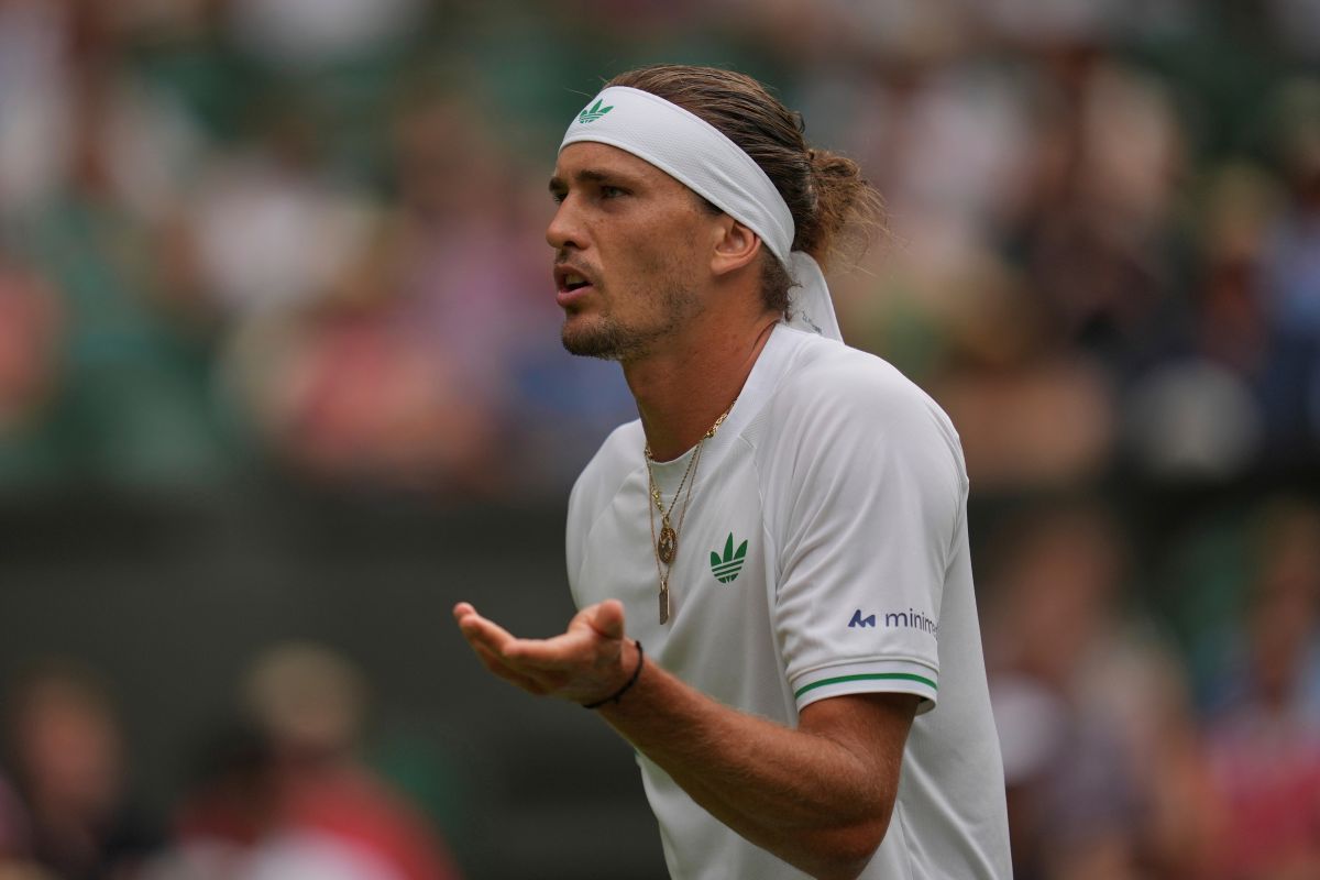 Alexander Zverev of Germany reacts as he plays Arthur Rinderknech of France during their first round men's singles match at the Wimbledon Tennis Championships in London, Tuesday, July 1, 2025. (AP Photo/Kin Cheung)