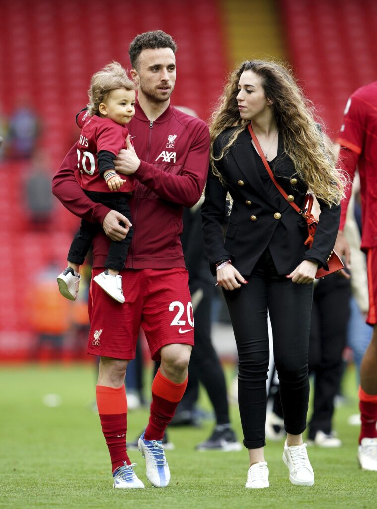 FILE - Liverpool's Diogo Jota walks the pitch with his family after the Premier League match at Anfield, Liverpool, Sunday May 22, 2022. (Peter Byrne/PA via AP, File)