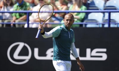 Dan Evans reacts during his men's singles match against Miomir Kecmanovic on day one of the Eastbourne Open at Devonshire Park Lawn Tennis Club, in Eastbourne, England, Monday, June 23, 2025. (John Walton/PA via AP)