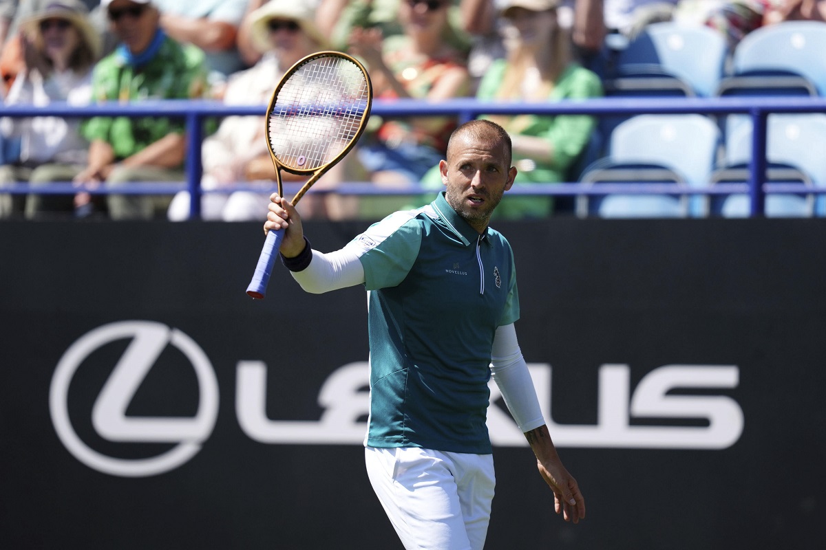 Dan Evans reacts during his men's singles match against Miomir Kecmanovic on day one of the Eastbourne Open at Devonshire Park Lawn Tennis Club, in Eastbourne, England, Monday, June 23, 2025. (John Walton/PA via AP)