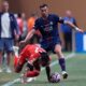 Bayern Munich's Michael Olise is fouled by Paris Saint-Germain's Fabian Ruiz during the Club World Cup quarterfinal soccer match between PSG and Bayern Munich in Atlanta, Saturday, July 5, 2025. (AP Photo/Mike Stewart)