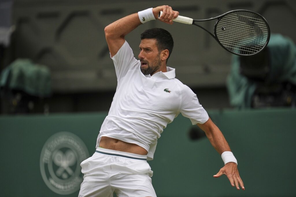 Serbia's Novak Djokovic returns to Australia's Alex de Minaur during a fourth round men's singles match at the Wimbledon Tennis Championships in London, Monday, July 7, 2025. (AP Photo/Kin Cheung)