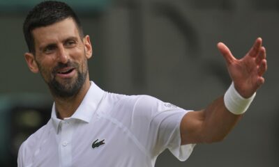 Serbia's Novak Djokovic gestures as he plays Italy's Flavio Cobolli during a quarterfinal men's singles match at the Wimbledon Tennis Championships in London, Wednesday, July 9, 2025. (AP Photo/Kin Cheung)