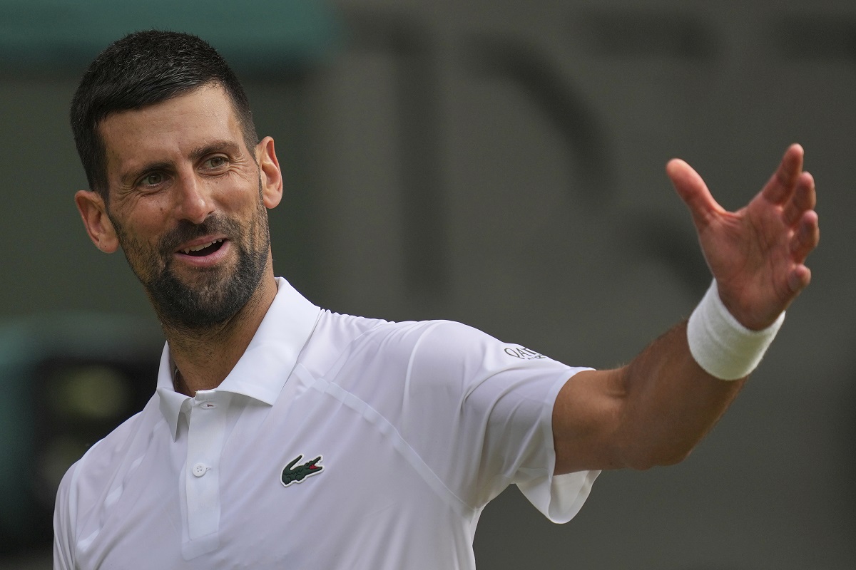 Serbia's Novak Djokovic gestures as he plays Italy's Flavio Cobolli during a quarterfinal men's singles match at the Wimbledon Tennis Championships in London, Wednesday, July 9, 2025. (AP Photo/Kin Cheung)