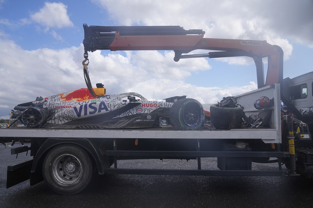Racing Bulls driver Isack Hadjar of France's car is removed from the track after a crash during the British Formula One Grand Prix race at the Silverstone racetrack in Silverstone, England, Sunday, July 6, 2025. (AP Photo/Darko Bandic)