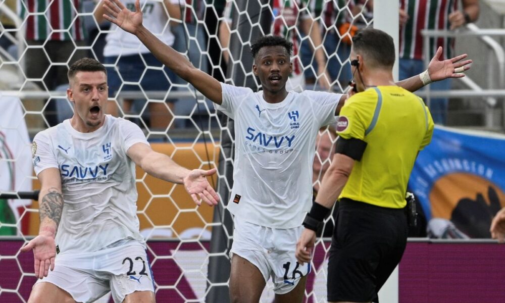 Al Hilal's Sergej Milinkovic-Savic, left, and Al Hilal's Nasser Al-Dawsari complain to the referee during the Club World Cup quarterfinal soccer match between Fluminense and Al Hilal in Orlando, Fla., Friday, July 4, 2025. (AP Photo/Phelan M. Ebenhack)