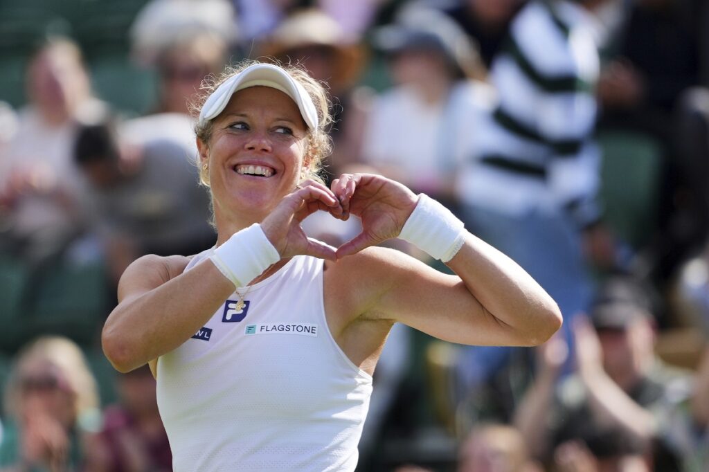Laura Siegmund of Germany celebrates winning her women's singles fourth round match against Solana Sierra of Argentina at the Wimbledon Tennis Championships in London, Sunday, July 6, 2025.(AP Photo/Kirsty Wigglesworth)