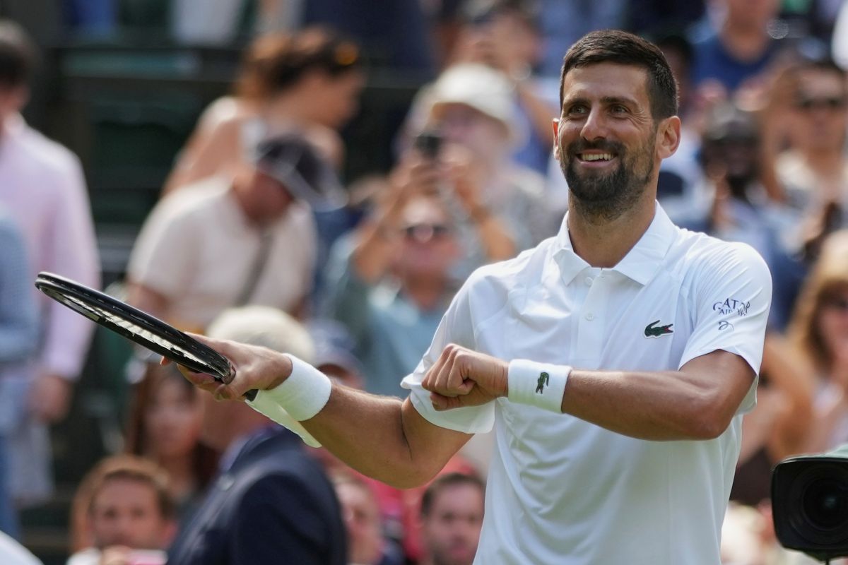 Novak Djokovic of Serbia reacts after beating Daniel Evans of Britain during their second round men's singles match at the Wimbledon Tennis Championships in London, Thursday, July 3, 2025. (AP Photo/Alastair Grant)
