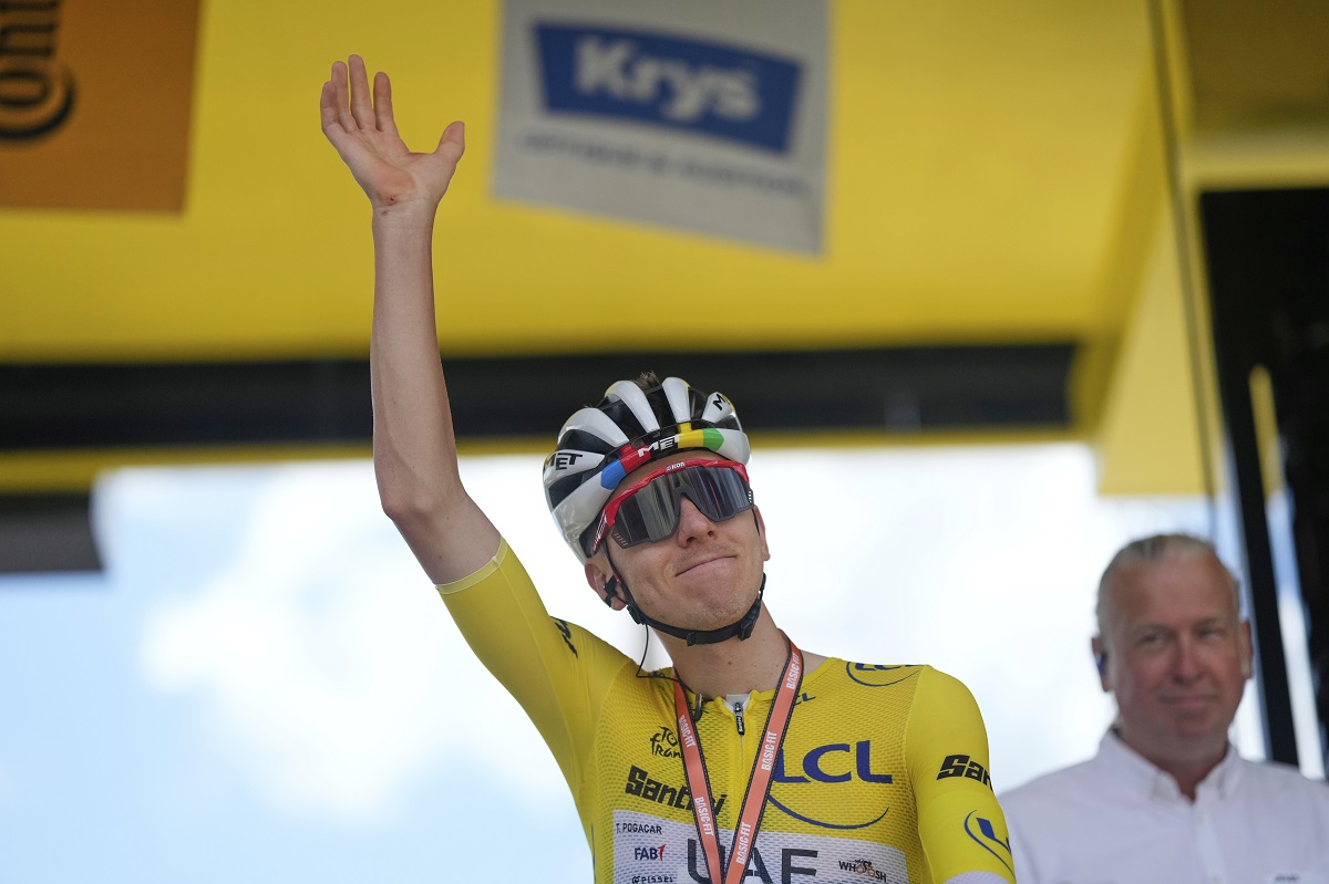 Slovenia's Tadej Pogacar, wearing the overall leader's yellow jersey, greets spectators prior to the start of the nineteenth stage of the Tour de France cycling race over 93.1 kilometers (57.85 miles) with start in Albertville and finish in La Plagne, France, Friday, July 25, 2025. (AP Photo/Mosa'ab Elshamy)