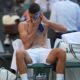 Novak Djokovic of Serbia wipes his face during a break as he plays Alexandre Muller of France during their first round men's singles match at the Wimbledon Tennis Championships in London, Tuesday, July 1, 2025. (AP Photo/Kin Cheung)
