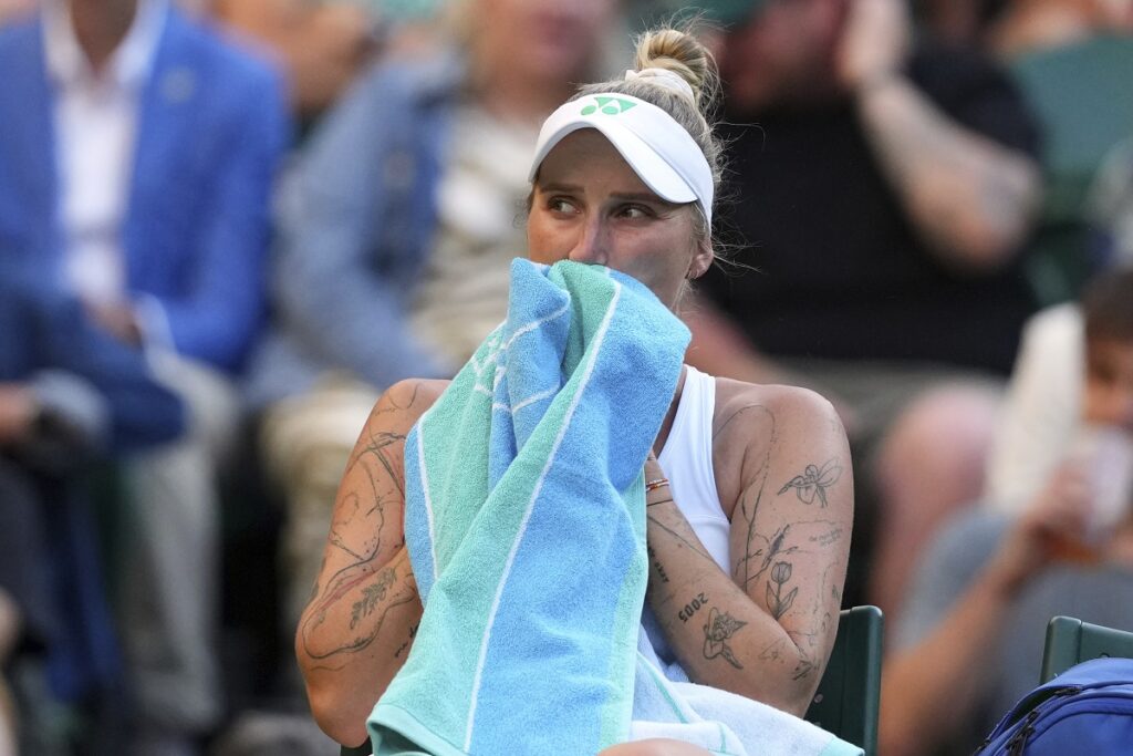 Marketa Vondrousova of the Czech Republic rests during the second round women's singles match against Emma Raducanu of Britain at the Wimbledon Tennis Championships in London, Wednesday, July 2, 2025.(AP Photo/Kirsty Wigglesworth)