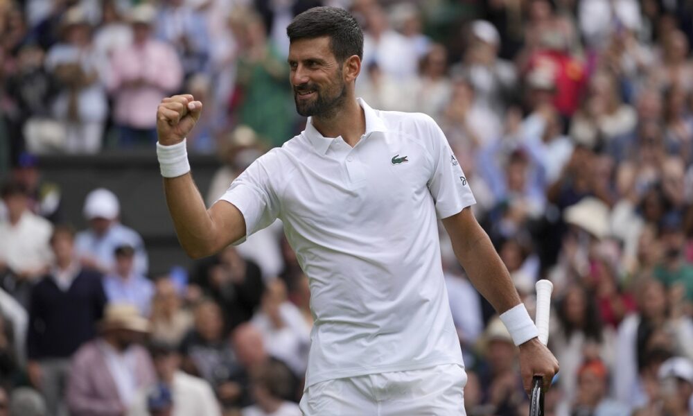 Serbia's Novak Djokovic celebrates after beating Australia's Alex de Minaur during a fourth round men's singles match at the Wimbledon Tennis Championships in London, Monday, July 7, 2025. (AP Photo/Kin Cheung)
