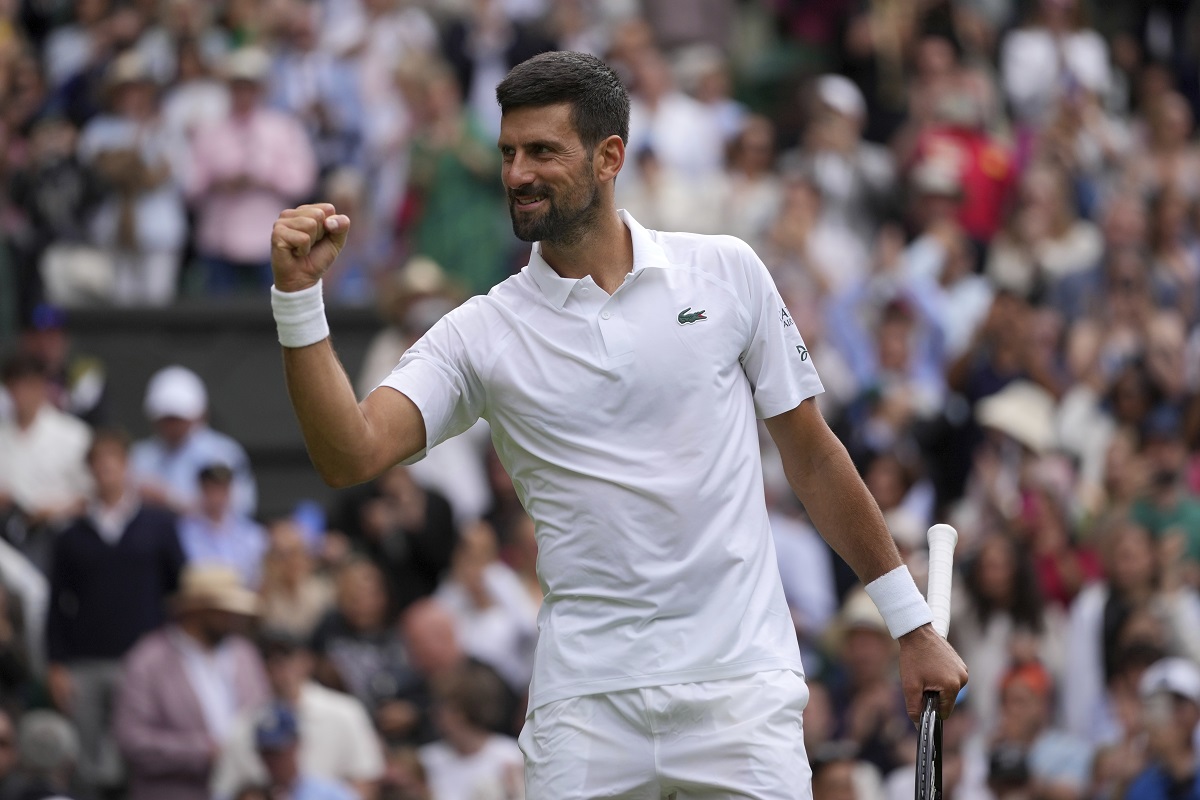 Serbia's Novak Djokovic celebrates after beating Australia's Alex de Minaur during a fourth round men's singles match at the Wimbledon Tennis Championships in London, Monday, July 7, 2025. (AP Photo/Kin Cheung)