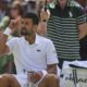 Serbia's Novak Djokovic gestures during a change of ends break against Australia's Alex de Minaur during a fourth round men's singles match at the Wimbledon Tennis Championships in London, Monday, July 7, 2025. (AP Photo/Kin Cheung)