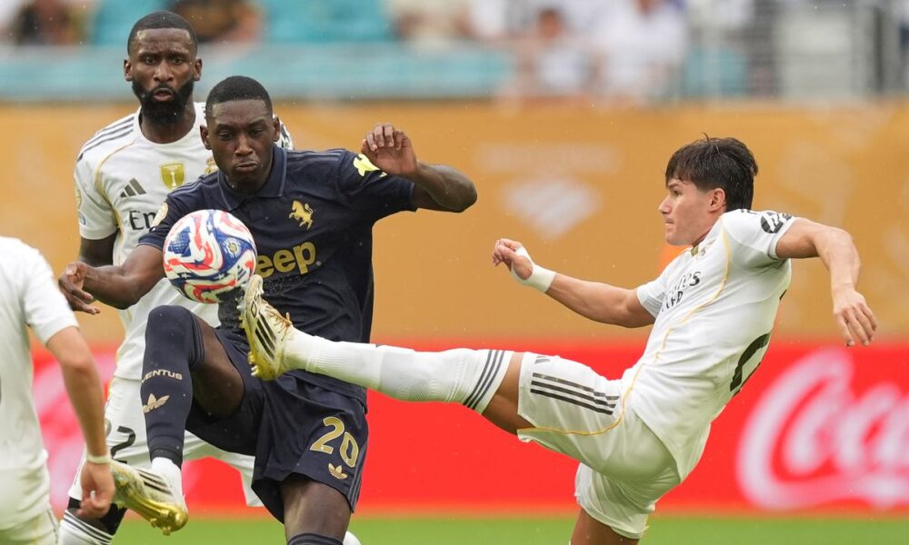 Juventus' Randal Kolo Muani, left, and Real Madrid's Fran Garcia fight for the ball during the Club World Cup round of 16 soccer match between Real Madrid and Juventus in Miami Gardens, Fla., Tuesday, July 1, 2025. (AP Photo/Rebecca Blackwell)