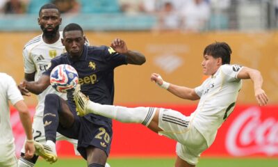 Juventus' Randal Kolo Muani, left, and Real Madrid's Fran Garcia fight for the ball during the Club World Cup round of 16 soccer match between Real Madrid and Juventus in Miami Gardens, Fla., Tuesday, July 1, 2025. (AP Photo/Rebecca Blackwell)