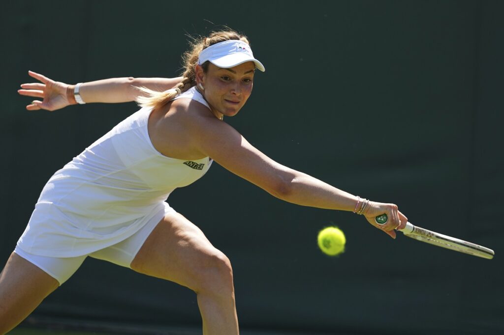 Donna Vekic of Croatia returns the ball to Kimberley Birrel of Australia during their first round women's single match at the Wimbledon Tennis Championships in London, Monday, June 30, 2025. (AP Photo/Kirsty Wigglesworth)