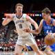 Oklahoma City Thunder guard Nikola Topić (44) drives the ball against Brooklyn Nets forward Danny Wolf (18) during the first half of an NBA summer league basketball game Thursday, July 10, 2025, in Las Vegas. (AP Photo/David Becker)