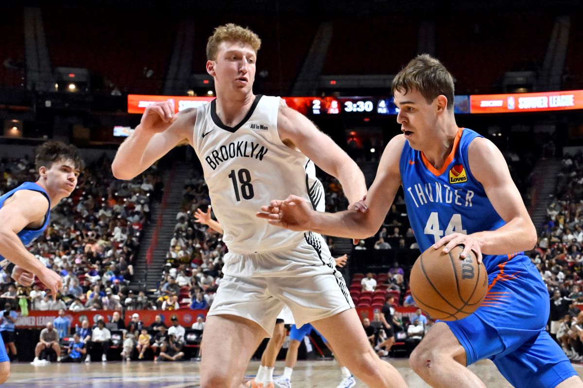 Oklahoma City Thunder guard Nikola Topić (44) drives the ball against Brooklyn Nets forward Danny Wolf (18) during the first half of an NBA summer league basketball game Thursday, July 10, 2025, in Las Vegas. (AP Photo/David Becker)