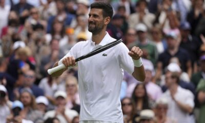 Serbia's Novak Djokovic celebrates after beating Australia's Alex de Minaur during a fourth round men's singles match at the Wimbledon Tennis Championships in London, Monday, July 7, 2025. (AP Photo/Kin Cheung)
